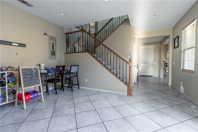 dining area with light tile patterned floors