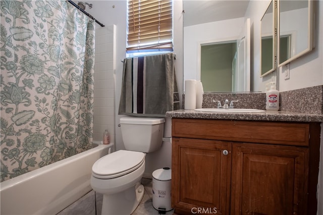 full bathroom featuring shower / bath combo, vanity, and toilet