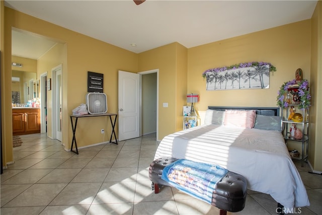 tiled bedroom with connected bathroom