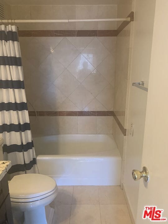 full bathroom with tile patterned floors, vanity, toilet, and shower / tub combo