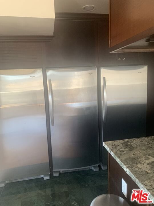 kitchen featuring light stone countertops