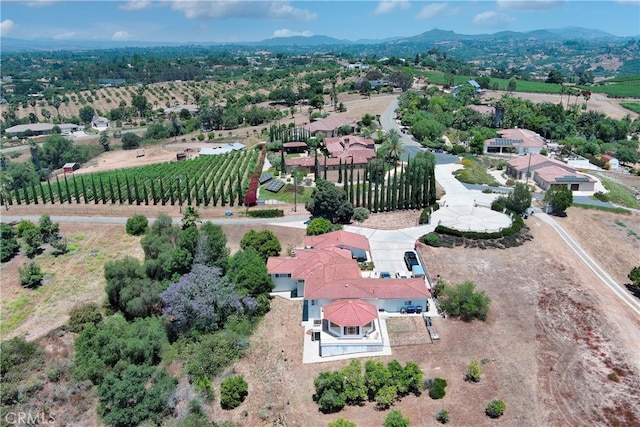 bird's eye view with a mountain view and a rural view