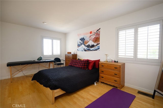 bedroom with light hardwood / wood-style flooring