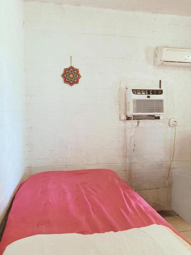 bedroom featuring an AC wall unit