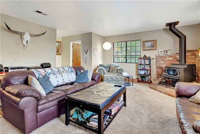 carpeted living room featuring a wood stove