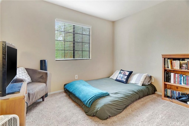 bedroom with light carpet