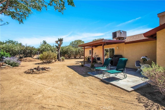 view of yard featuring central AC unit and a patio area