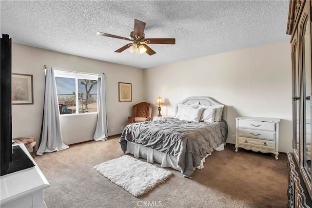 bedroom with ceiling fan, light colored carpet, and a textured ceiling