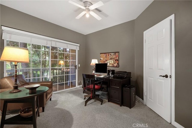 office space with light colored carpet and ceiling fan