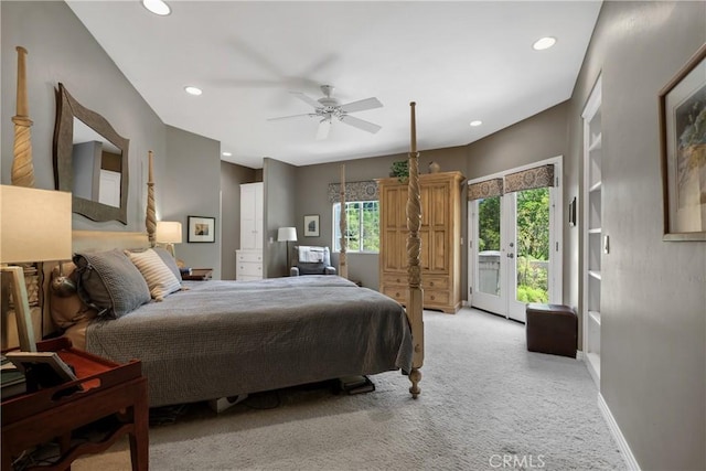 carpeted bedroom with access to outside, ceiling fan, and french doors