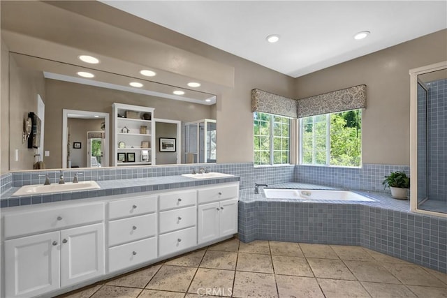 bathroom with vanity, separate shower and tub, and tile patterned floors