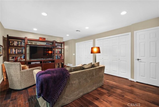 living room featuring dark hardwood / wood-style floors