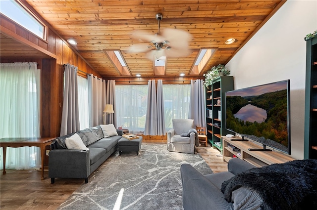 living room with wooden walls, ceiling fan, wooden ceiling, and hardwood / wood-style flooring