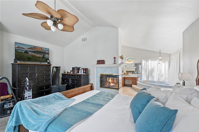 bedroom with light colored carpet, ceiling fan, and lofted ceiling