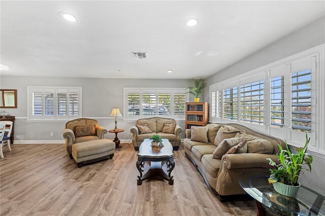 living room with light hardwood / wood-style flooring