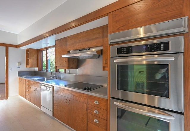 kitchen with sink, dishwasher, double oven, black electric stovetop, and ventilation hood