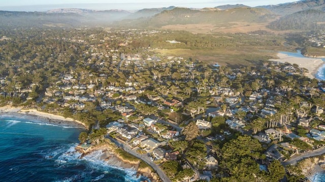 aerial view featuring a water and mountain view