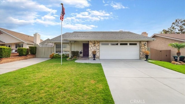 ranch-style home featuring a garage and a front yard