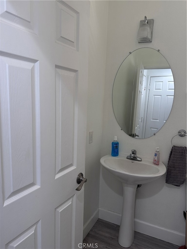 bathroom with hardwood / wood-style floors