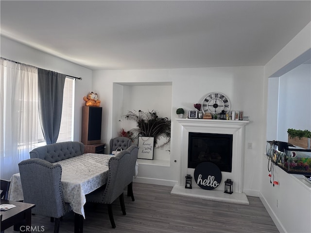 dining area with dark wood-type flooring