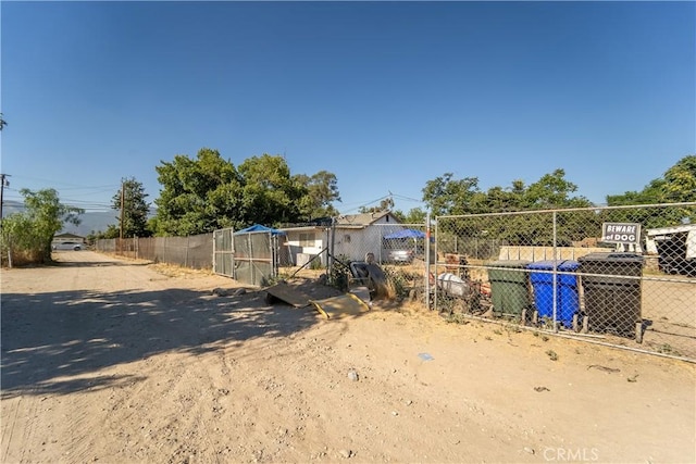 2161 Blake St, San Bernardino, CA 92407 - view of yard with exterior structure, an outdoor structure, and fence