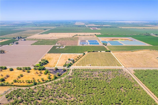 birds eye view of property with a rural view