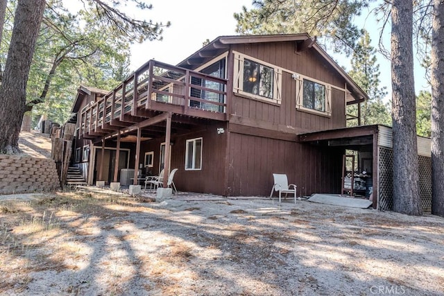 rear view of property with a deck