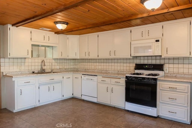 kitchen with white appliances, sink, light tile patterned floors, wooden ceiling, and white cabinets