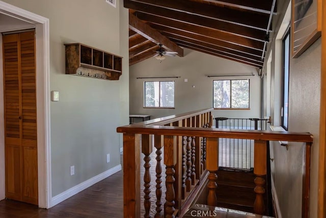 staircase with vaulted ceiling with beams, a wealth of natural light, ceiling fan, and wood-type flooring