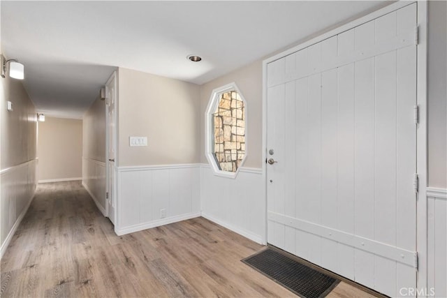 foyer entrance with light wood-type flooring