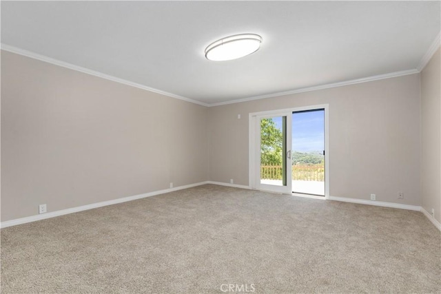 unfurnished room featuring light colored carpet and crown molding