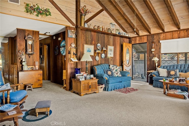 living room with wood walls, carpet flooring, beamed ceiling, wooden ceiling, and high vaulted ceiling