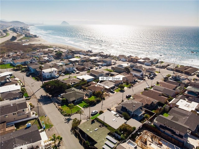 drone / aerial view with a view of the beach and a water view