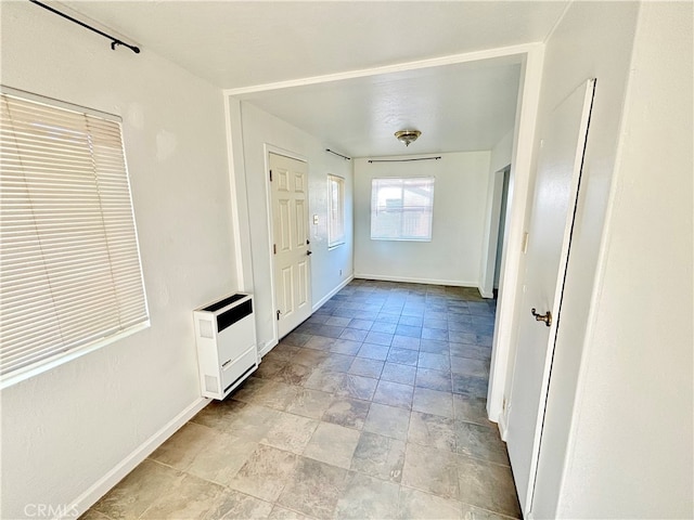 hallway featuring heating unit