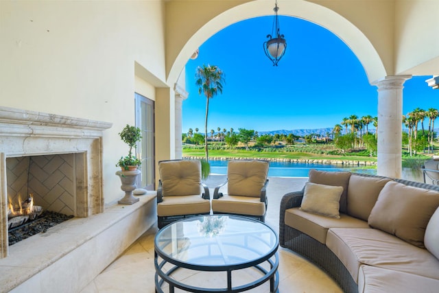 view of patio featuring an outdoor living space with a fireplace