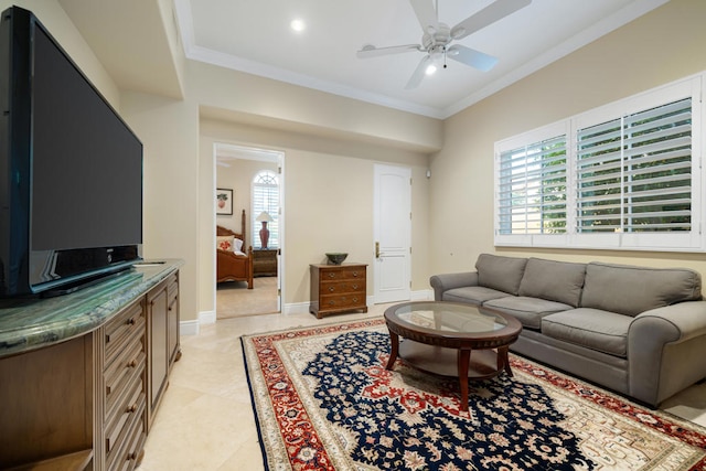 tiled living room with ceiling fan and crown molding