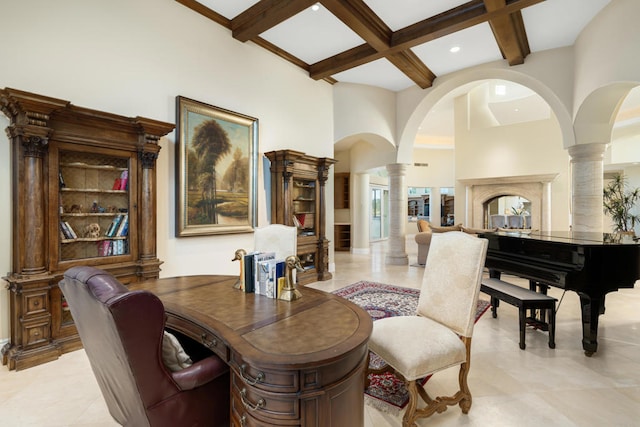 interior space featuring beamed ceiling, light tile patterned flooring, coffered ceiling, decorative columns, and a high ceiling