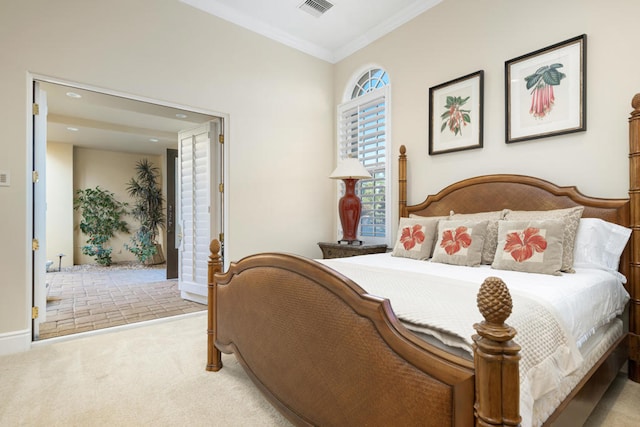 bedroom with crown molding and light colored carpet