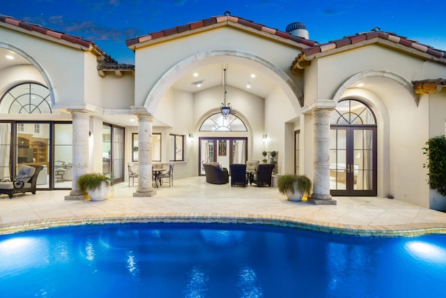 back of house featuring a patio and french doors