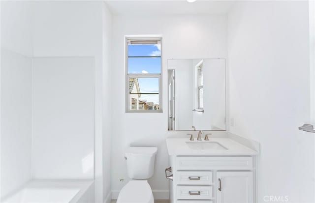 bathroom with vanity, toilet, and walk in shower