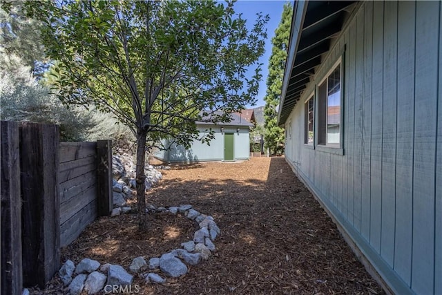 view of yard with a storage unit