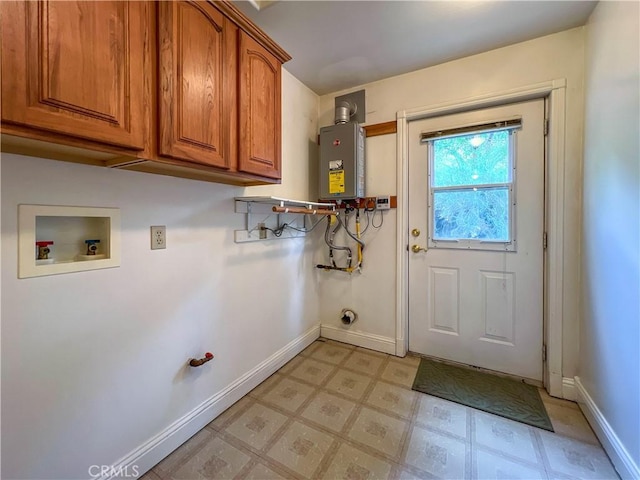 clothes washing area featuring washer hookup, water heater, cabinets, and gas dryer hookup