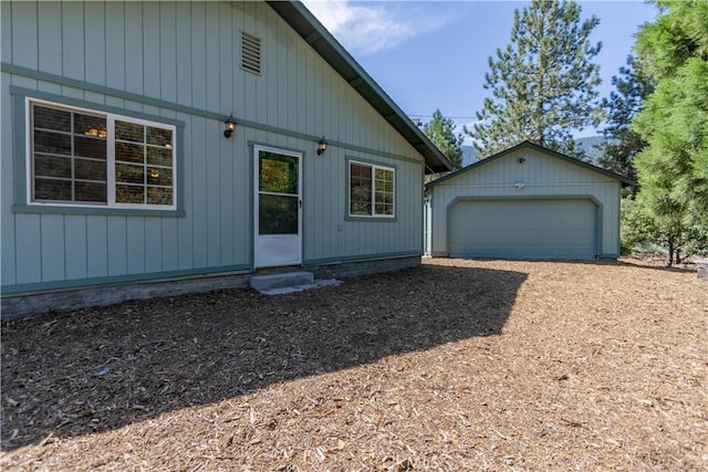 view of front of house with an outbuilding and a garage