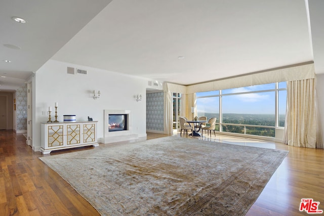 unfurnished living room with hardwood / wood-style floors