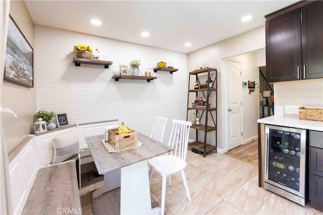 dining room featuring wine cooler and indoor bar