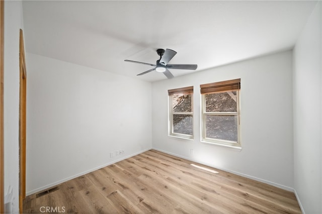 unfurnished room with ceiling fan and light wood-type flooring