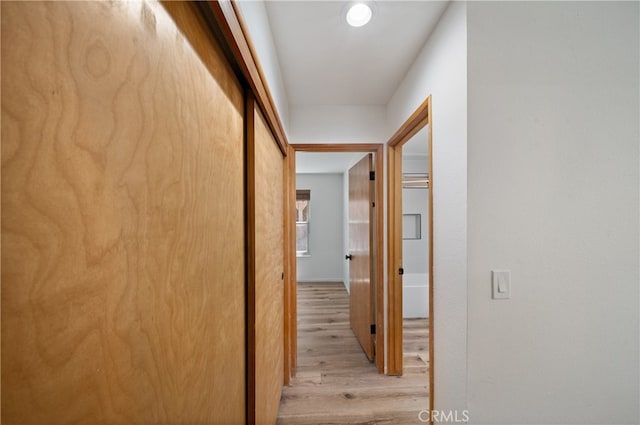 corridor featuring light hardwood / wood-style floors