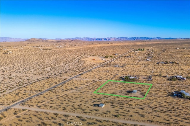 birds eye view of property featuring a mountain view