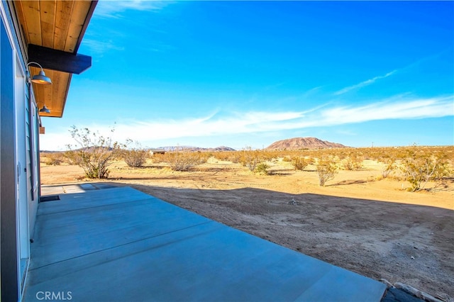 view of patio featuring a mountain view