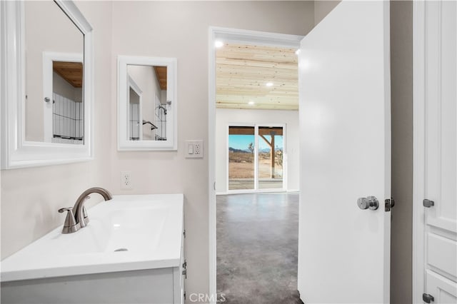 bathroom with concrete flooring and vanity